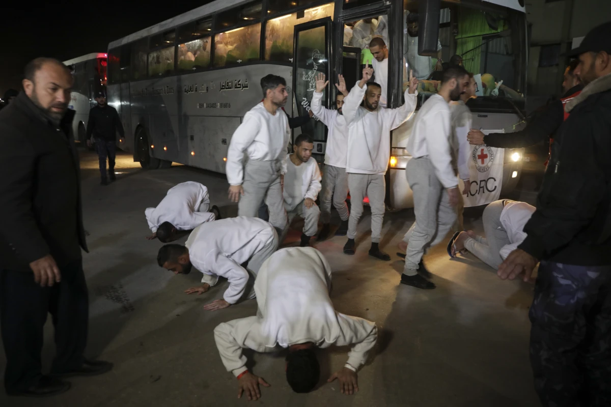 Freed Palestinian prisoners react as they arrive in the Gaza Strip after being released from an Israeli prison following a ceasefire agreement between Hamas and Israel in Khan Younis, Gaza Strip, on Thursday.