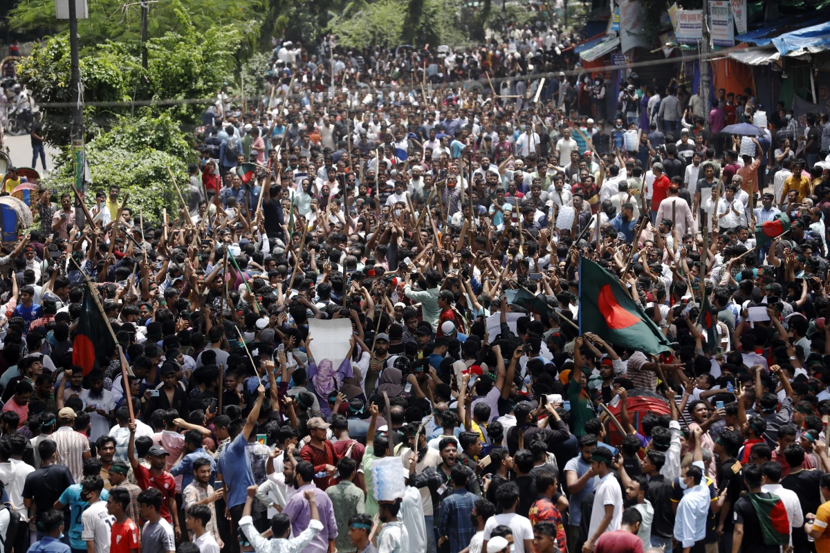 People participate in a rally against Prime Minister Sheikh Hasina and her government in Dhaka, Bangladesh on Sunday.