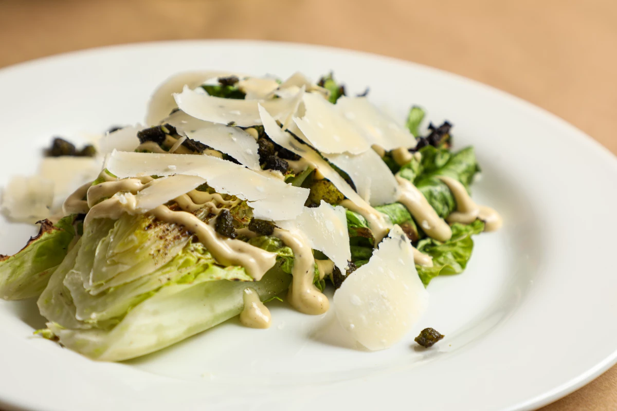The Caesar salad was born 100 years ago, on July 4, 1924, in Tijuana, Mexico. Above, the grilled romaine Caesar salad at Boucherie, a restaurant in uptown New Orleans.