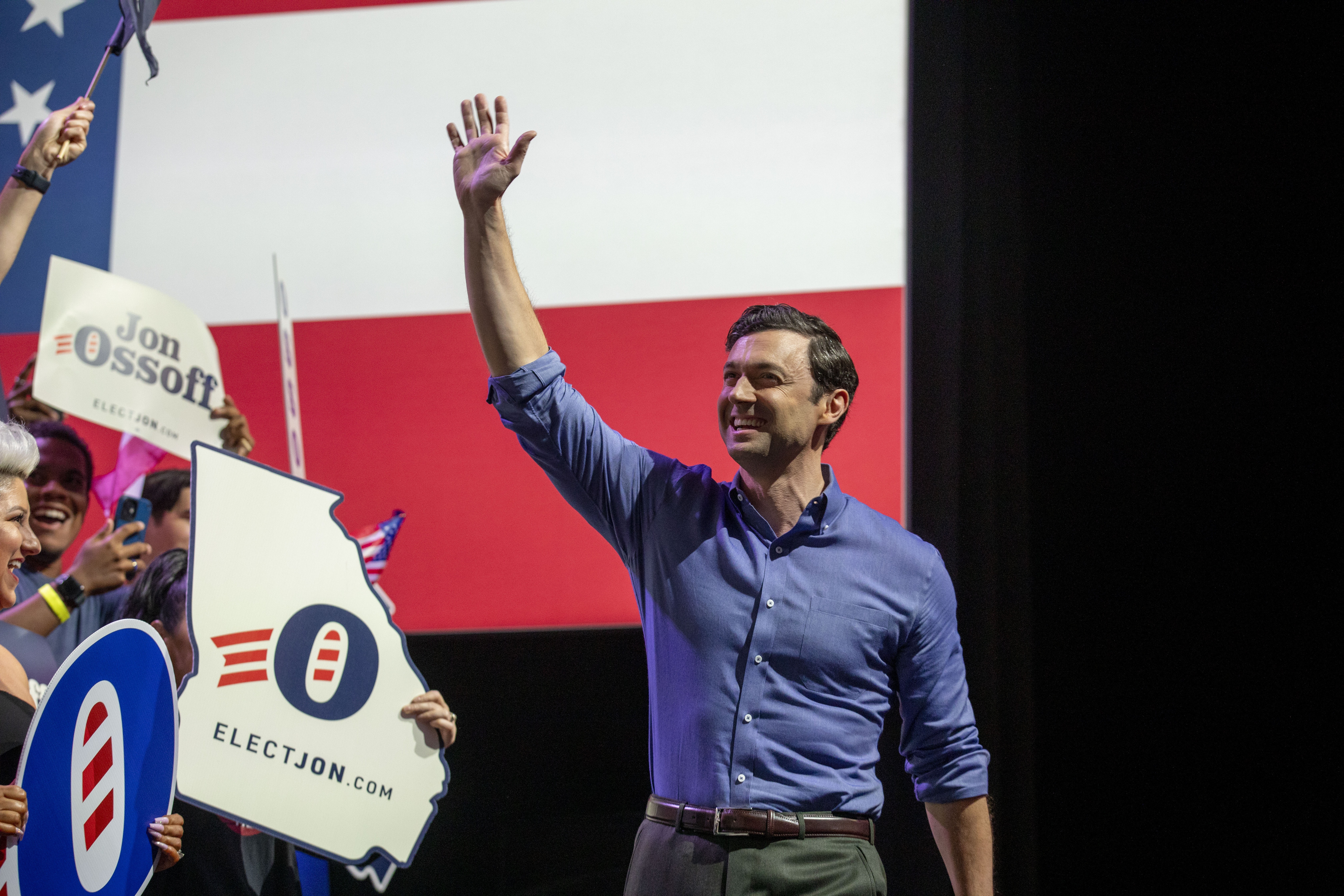 Sen. Jon Ossoff greets supporters before speaking during a campaign rally at Center Stage in Atlanta on August 16, 2026.