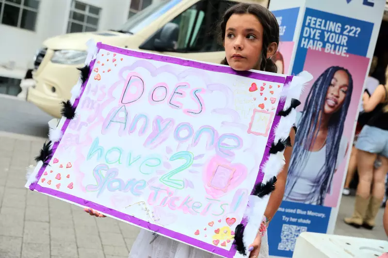 A young fan tries her luck outside Taylor Swift's concert in London in August 2024.