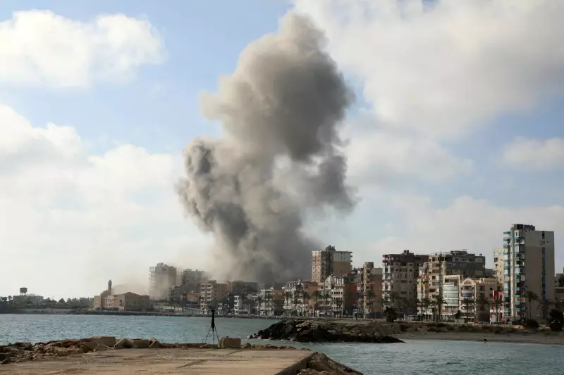 An Israeli airstrike hits the southern Lebanese coastal town of Tyre on Sunday. Israel and Hezbollah continue to exchange fire despite a ceasefire agreement announced last week between the governments of Israel and Lebanon.