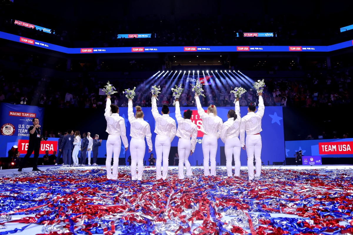 From left, Hezly Rivera, Joscelyn Roberson, Suni Lee, Simone Biles, Jade Carey, Jordan Chiles and Leanne Wong pose after being selected for the 2024 U.S. Olympic Women's Gymnastics Team on Day Four of the 2024 U.S. Olympic Team Gymnastics Trials in Minneapolis.