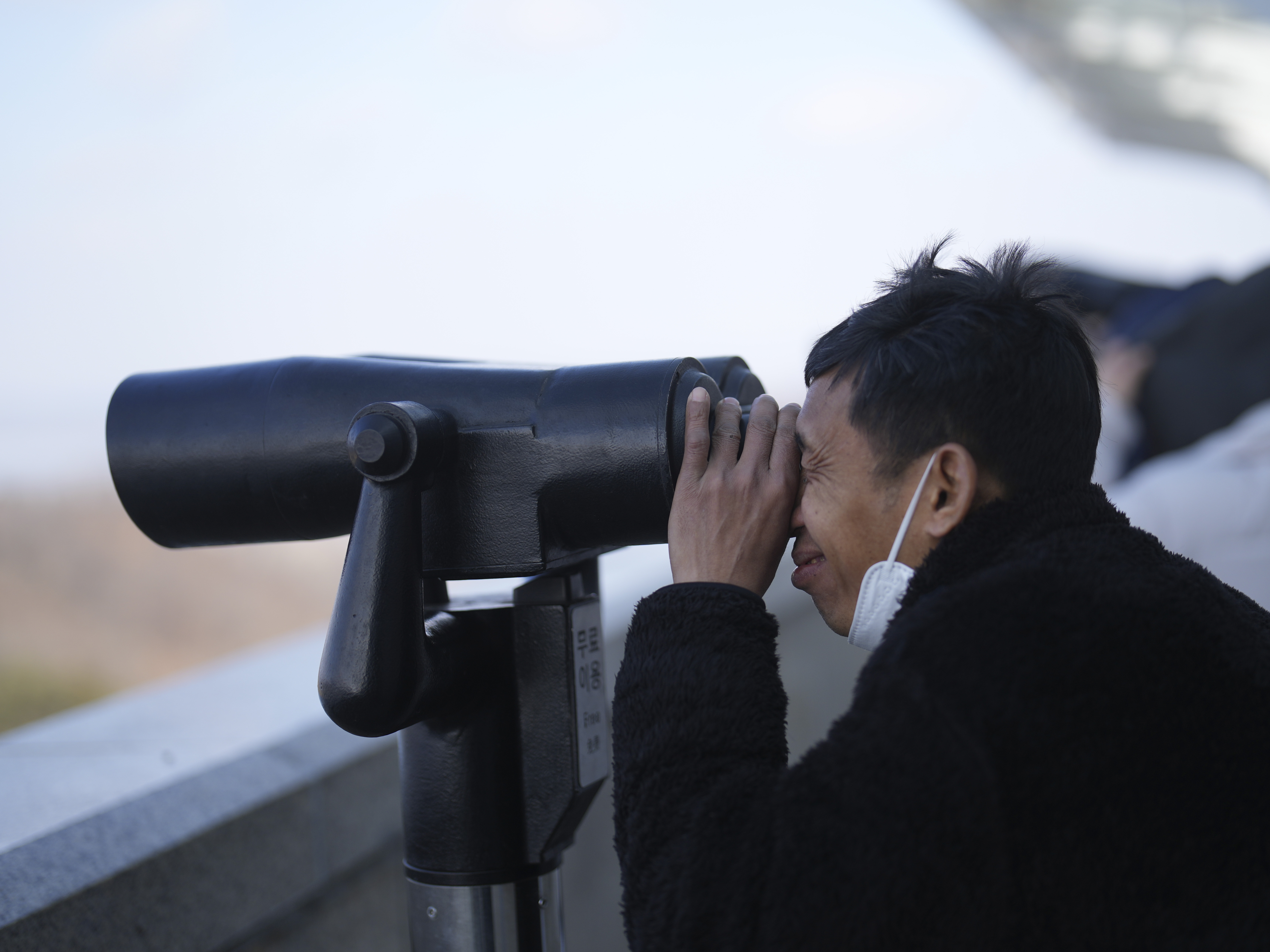 A visitor watches the North Korean side from the unification observatory in Paju, South Korea, on Jan. 29, 2025.