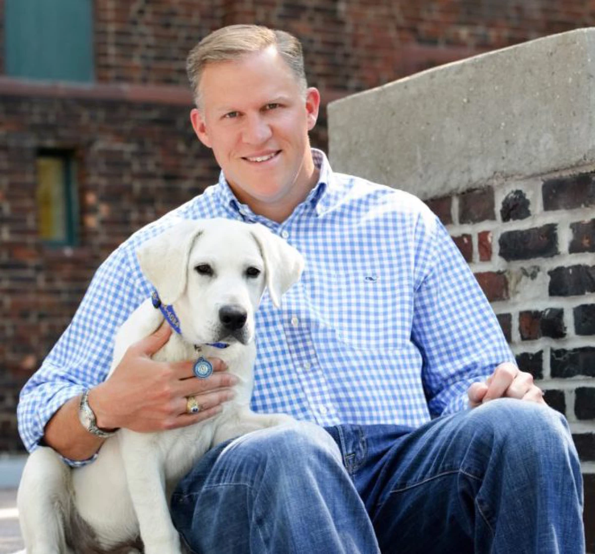 Barton O'Brien, shown with his dog Walter, runs the BAYDOG company that sells harnesses and other pet supplies. Facing new tariffs, he had rushed to stockpile shipments from China and canceled an order from India.