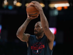 Los Angeles Clippers forward Kawhi Leonard warms up before an NBA basketball game April 10, 2026, in Portland, Ore.
