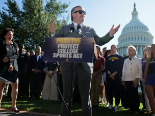 Sen. Ted Cruz, along with Sen. Maria Cantwell and Sen. Shelley Moore Capito, holds a news conference with NCAA athletes and coaches about the Protect College Sports Act on Sept. 14 in Washington, D.C.