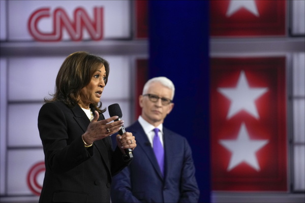 Vice President Harris speaks during a CNN town hall in Aston, Pa., on Wednesday as moderator Anderson Cooper listens in.