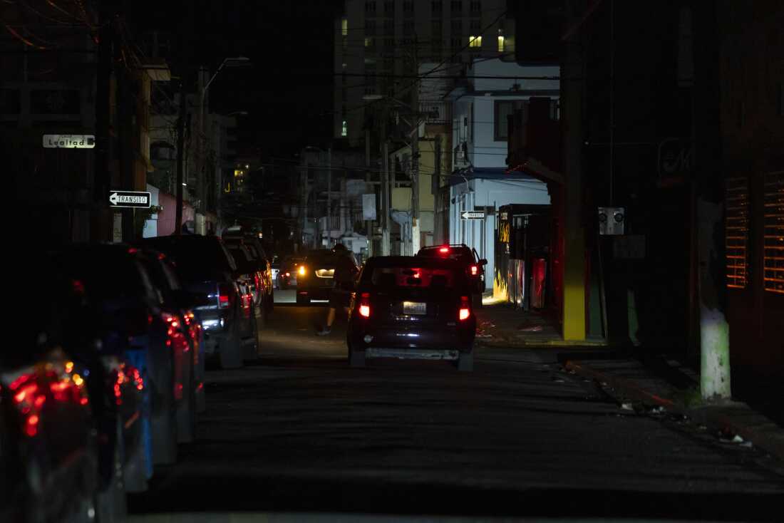 A street is dark during a blackout in San Juan, Puerto Rico, after sunset on Tuesday