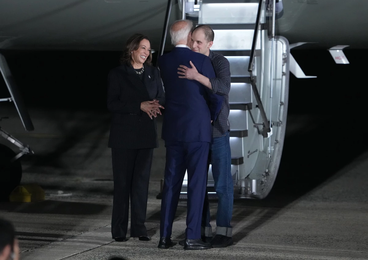 President Biden hugs Evan Gershkovich, a Wall Street Journal reporter freed by Russia in a multinational prisoner exchange, on Aug. 1, 2024 at Joint Base Andrews in Maryland.