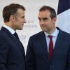 Then French Defense Minister Sébastien Lecornu (right) and France's President Emmanuel Macron talk at the end of an address by the president to army leaders in Paris on July 13.