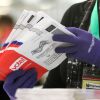 An election worker sorts vote-by-mail ballots for the presidential primary at King County's elections office in Renton, Wash., in March 2020.