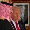 With a photograph of himself on the wall as part of "The Presidential Hall of Fame," U.S. President Donald Trump (R) gives Crown Prince and Prime Minister Mohammed bin Salman of Saudi Arabia a tour of the White House on November 18, 2025 in Washington, D.C.