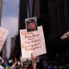 A person holds a sign with a photo of Kilmar Abrego Garcia at a protest in New York City.