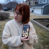 Keira Coady holds a photo of her brother, Sgt. Declan Coady, 20, outside her home Tuesday in West Des Moines, Iowa.