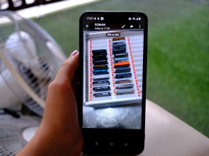 A man who worked in scam compound in Cambodia shows the only evidence he managed to document on his phone, a photo of dozens of phones that he was given to reach out and recruit potential scam victims.