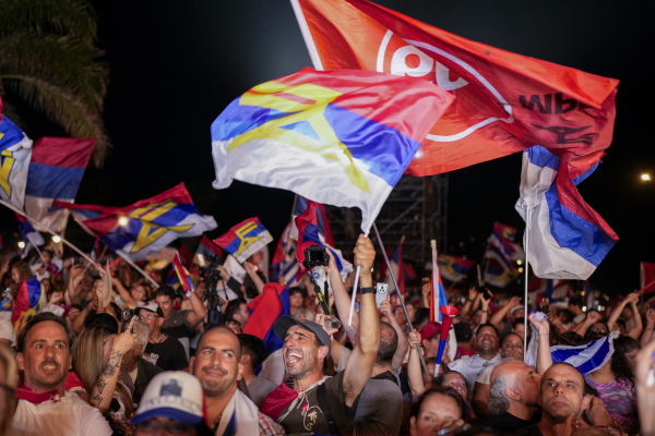 Supporters of Yamandu Orsi, candidate for the Broad Front (Frente Amplio), celebrate early results after polls closed in the presidential run-off election in Montevideo, Uruguay on Sunday.