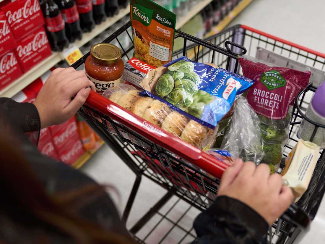 A California's SNAP benefits shopper pushes a cart through a supermarket in Bellflower, Calif., Feb. 13, 2023.