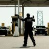 U.S. Customs and Border Protection agents direct vehicles re-entering the U.S. from Canada at the Ambassador Bridge Port of Entry in Detroit.