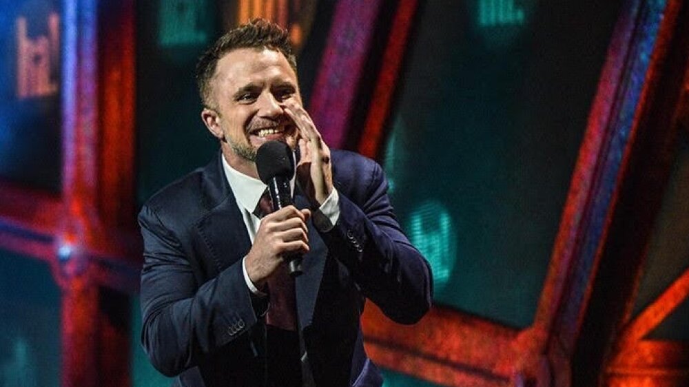 To reach others in the deaf community, stand-up comedian D.J. Demers is often joined on stage by a sign language interpreter. Jennifer Lees (left) has interpreted many of his performances including the 2024 All Access Comedy Show in Halifax, Nova Scotia.