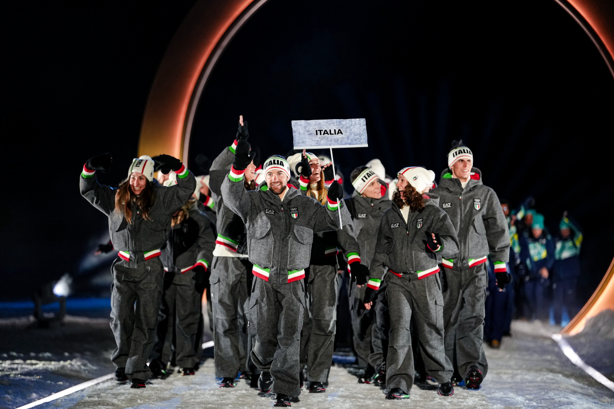 Italy athletes take part in the athletes parade during the Olympic opening ceremony at the 2026 Winter Olympics, in Predazzo, Italy, Friday, Feb. 6, 2026.
