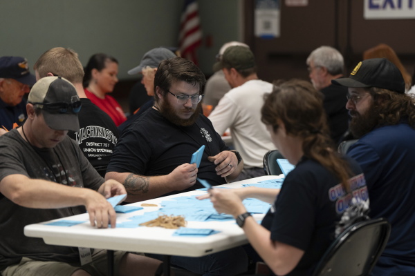 Members of the International Aerospace Machinists count votes on a contract offer by airplane maker Boeing on Thursday in Seattle.