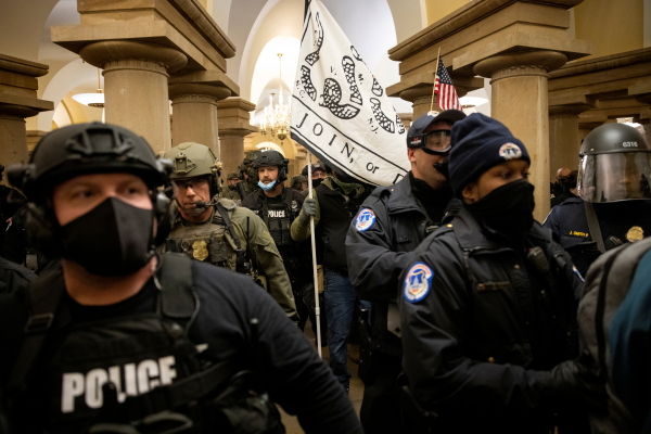 FBI and ATF law enforcement push out supporters of then-President Donald Trump as they protested inside the U.S. Capitol on January 6, 2021.