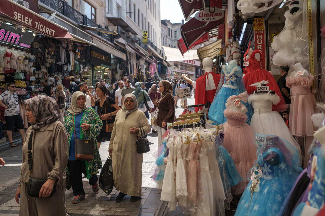Locals and visitors shop for traditional wedding items at the historic Mahmutpaşa Bazaar, next to the Grand Bazaar in Fatih, Istanbul, Turkey, on Aug. 26, 2026. Mahmutpaşa is one of Istanbul’s largest shopping areas and is known for its wide range of wedding goods, from bridal dresses and tuxedos to rugs and household items. Many people still come here to prepare for their weddings because of its affordable prices and wide selection.