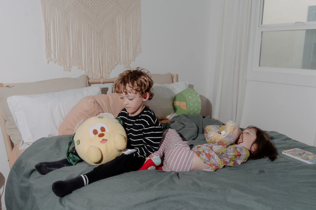 Eugene and Zella Eakin play with stuffed animals in their temporary home in El Sereno, Calif.