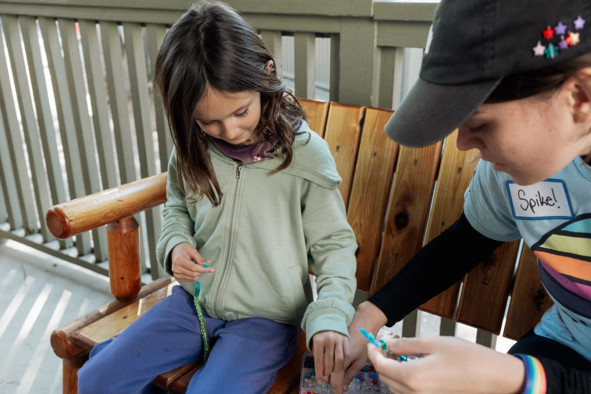 Campers and counselors make beaded bracelets together at Project:Camp in Glendale, Calif.