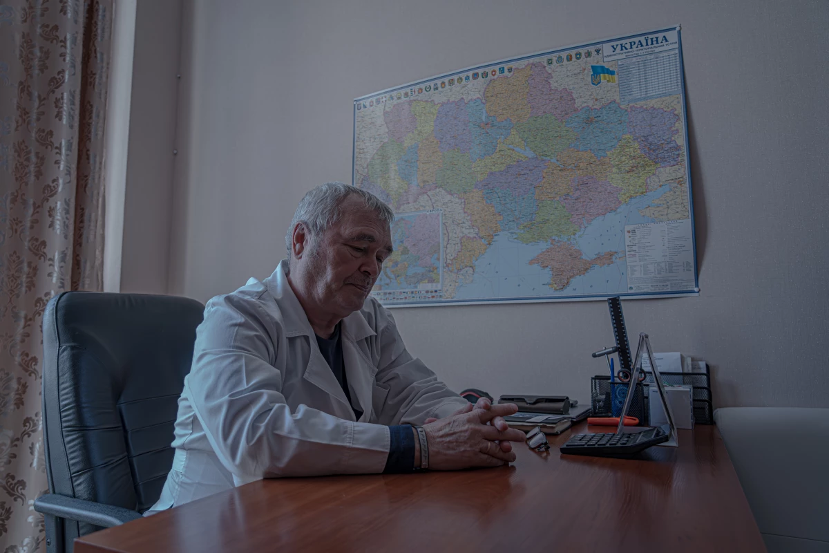 Volodymyr Ivanenko, 69, director of Sloviansk City Clinical Hospital  in his office in front of the map of Ukraine.