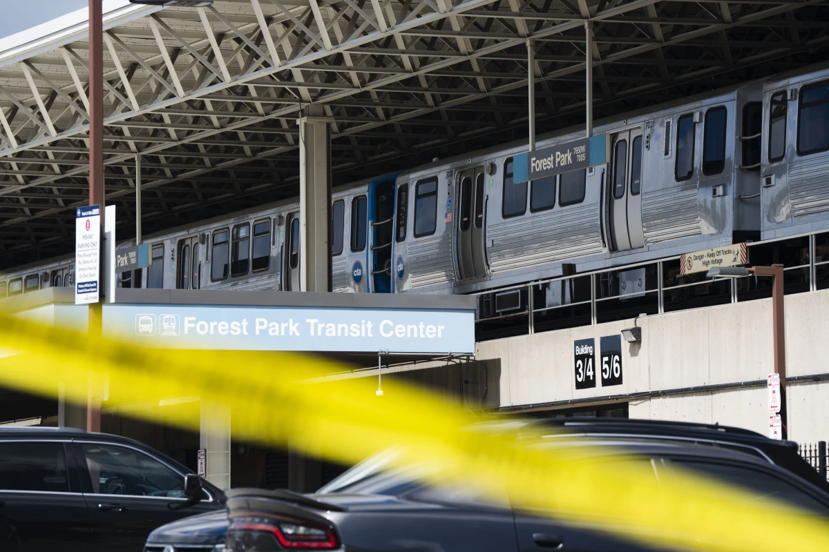 Yellow tape blocks off the parking lot of the Forest Park Blue Line train station in Forest Park, Ill., after four people were fatally shot on the train early Monday, Sept. 2, 2024.