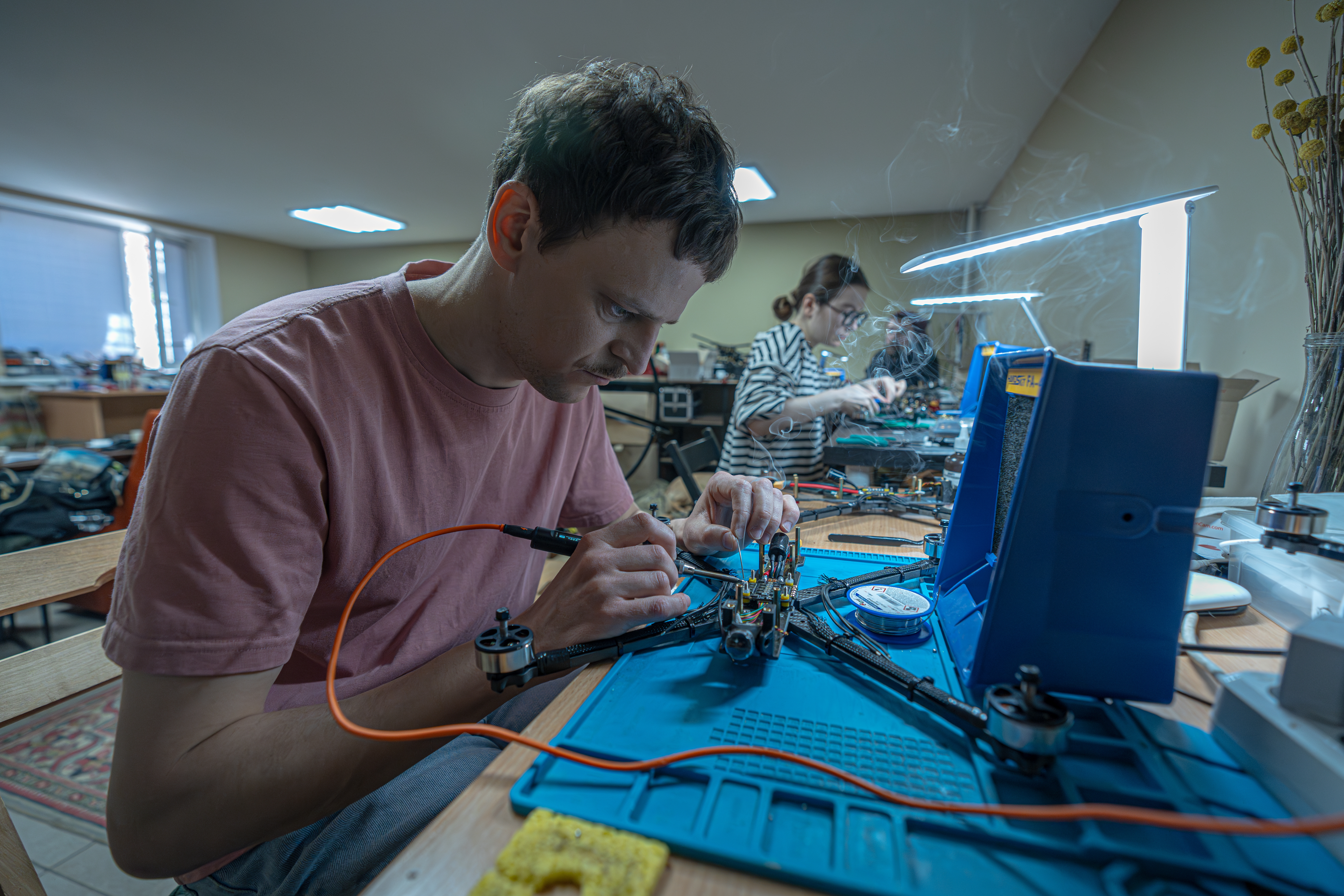 Biophysicist Oleh Halaidych, 34, helps make drones at a workshop in Kyiv. "I think we are all motivated because we see that this is a cheap and accessible way to make weapons," he says. "They kill the enemy and destroy his armored vehicles."