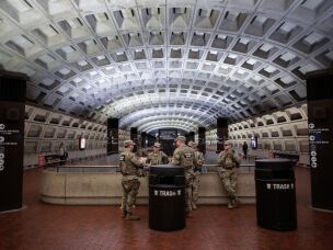 U.S. Army National Guard members stand inside the Metro Center subway station in the heart of downtown on May 16, 2026 in Washington, DC.
