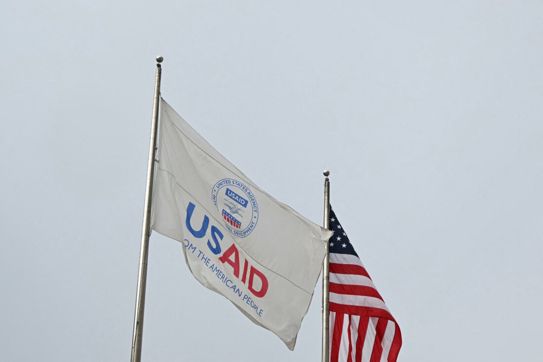 A USAID and American flag outside of United States Agency for International Development (USAID) headquarters in Washington, DC, on Feb. 3, 2025.