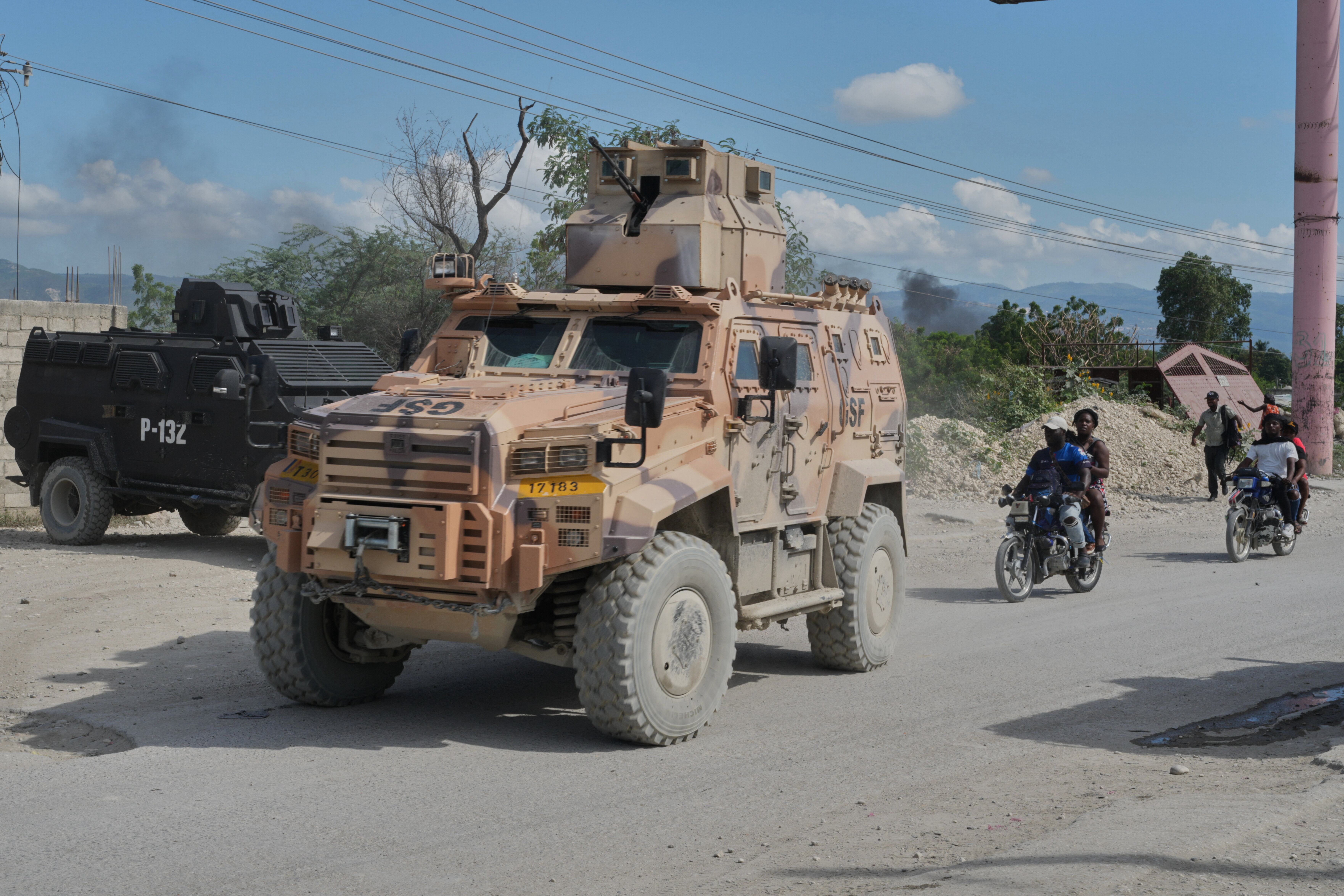 Armored police vehicles that are part of the Gang Suppression Force (GSF) patrol the Tabarre neighborhood of Port-au-Prince, Haiti, Monday, Oct. 19, 2026.