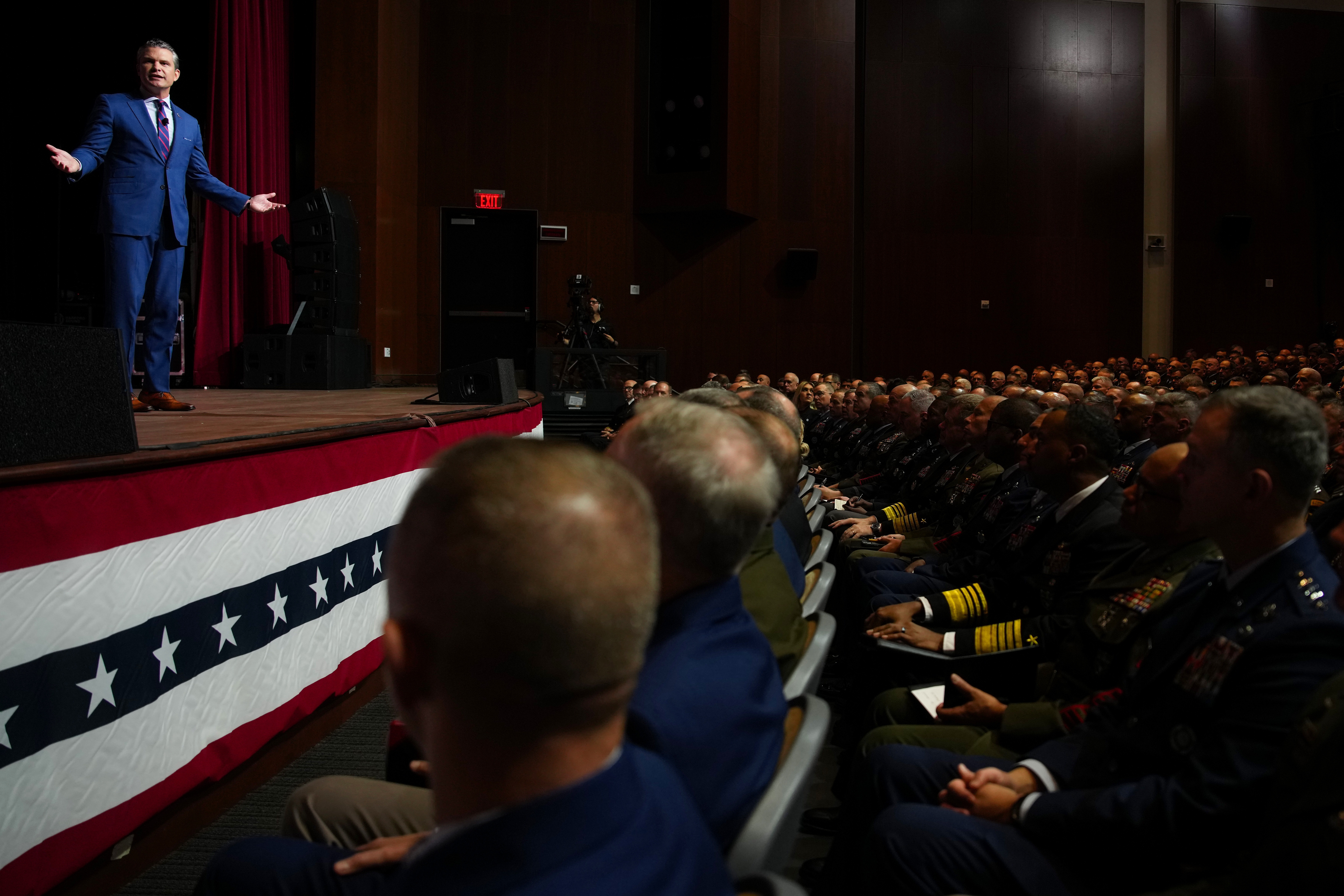 Defense Secretary Pete Hegseth speaks to senior military leaders at Marine Corps Base Quantico on Sept. 30, in Quantico, Va. In an unprecedented gathering, almost 800 generals, admirals and their senior enlisted leaders have been ordered into one location from around the world on short notice.