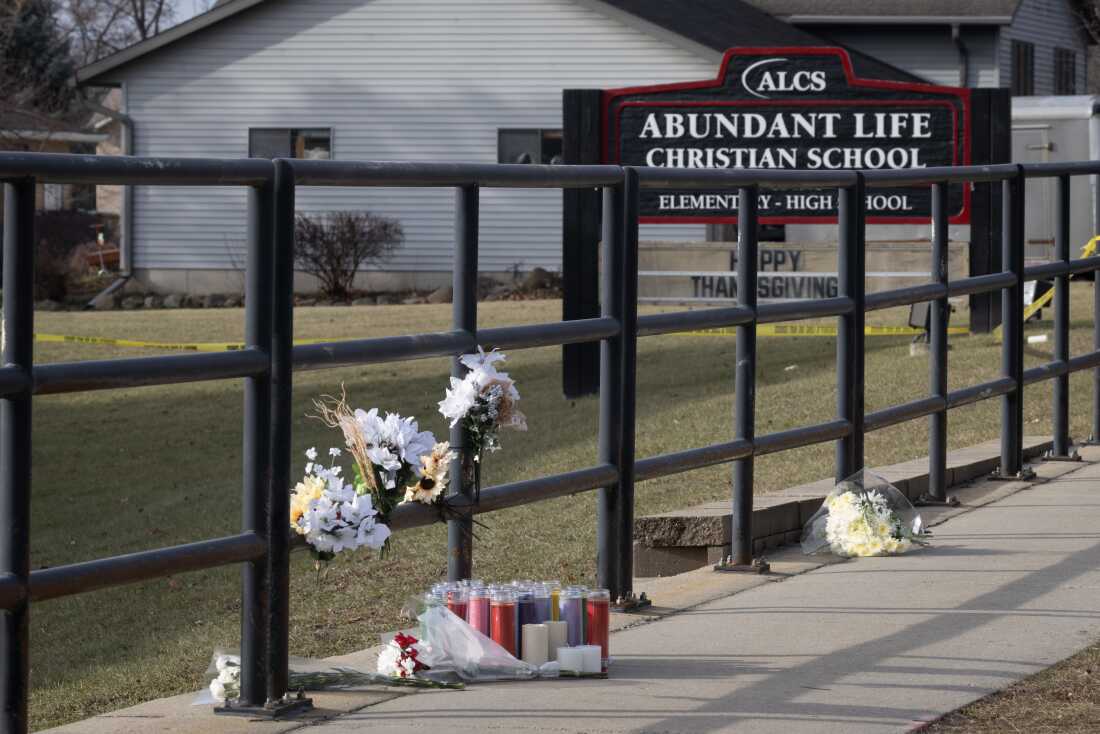 A makeshift memorial sits in front of Abundant Life Christian School in Madison, Wisconsin, on December 17, 2024, the day after a shooting there.