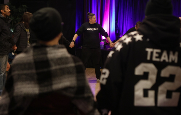 Sam Koshiol-Wright of Sequeerity helps lead a community outreach event in Minneapolis on Dec. 4.