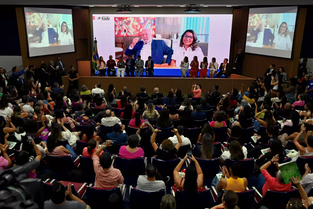 For 20 years, Brazil's Bolsa Familia Program — Portuguese for 'family allowance' — has given a monthly cash payment to low-income families. A new study shows an unexpected consequence: a dramatic drop in rates of TB. Above: Brazilian President Luiz Inacio Lula da Silva and First Lady Rosângela da Silva participate via videoconference in the celebration of the 20th anniversary of the program, which was established during his first term.