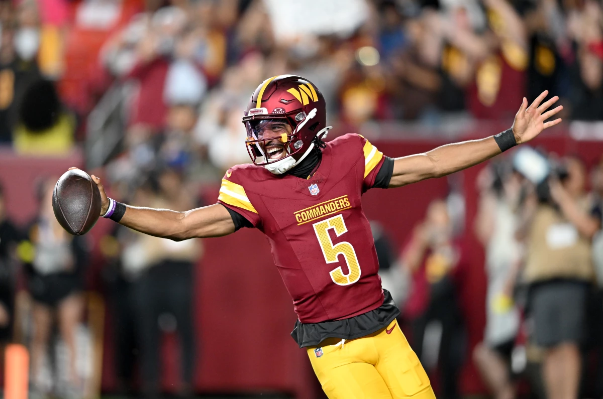Washington Commanders quarterback Jayden Daniels celebrates after rushing for a touchdown against the Cincinnati Bengals during a preseason game last month. Daniels, last year's Offensive Rookie of the Year winner, hopes to build on his success this year.