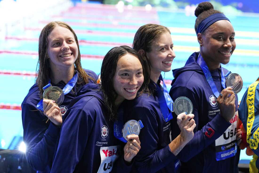 Silver medalist team United States pose after the women's 4x100-meter freestyle final at the World Aquatics Championships in Singapore on Sunday.