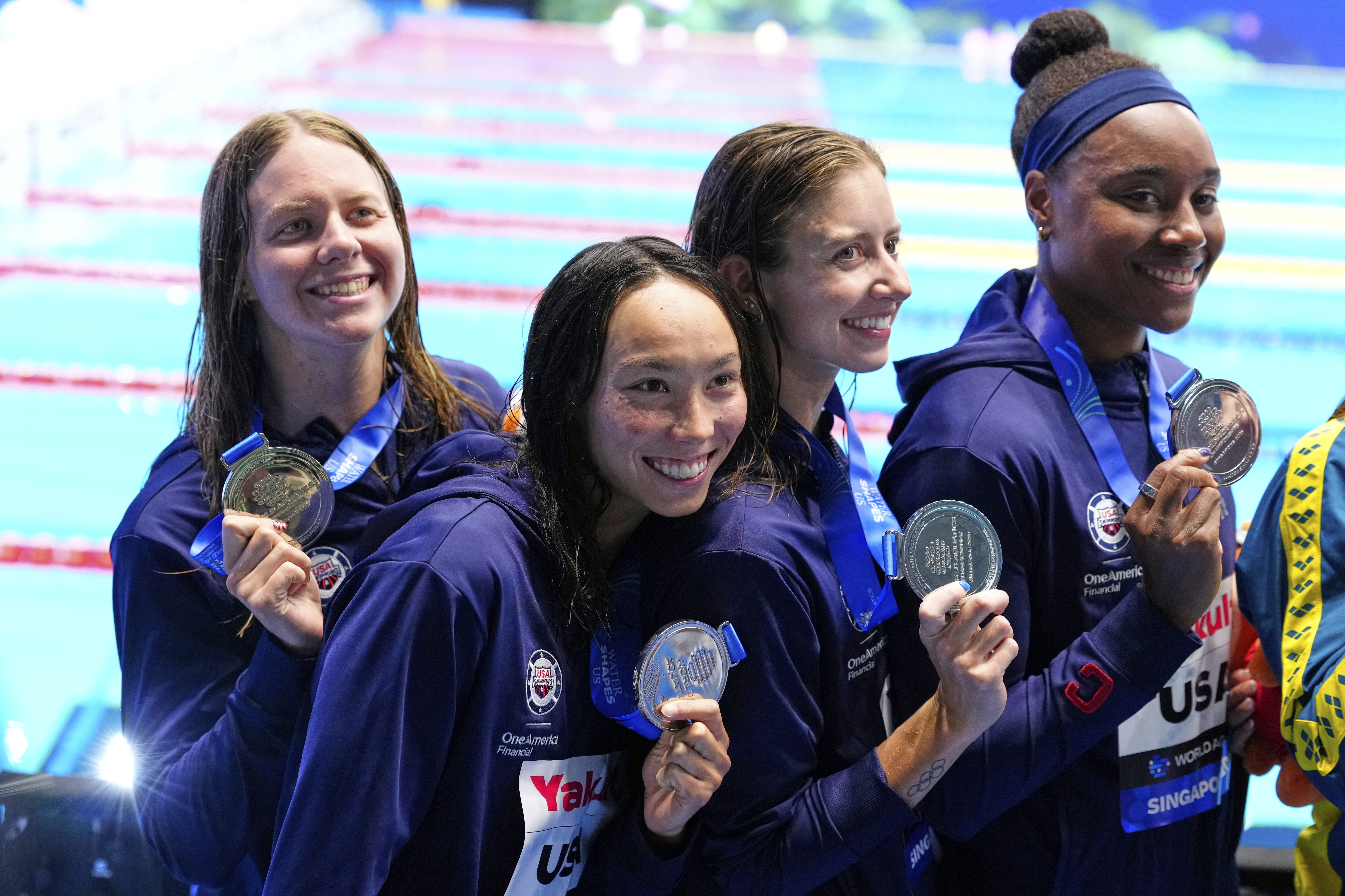 Silver medalist team United States pose after the women