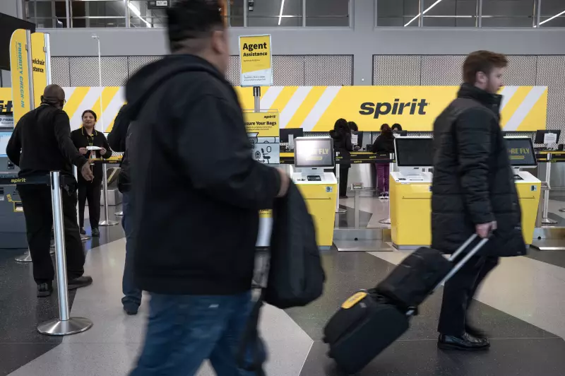 Passengers check in for their Spirit Airlines flights at O'Hare Airport on March 10, 2026 in Chicago, Illinois. The budget airline has announced it will cease operations.