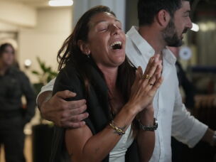 Passengers who experienced an emergency landing in Saudi Arabia during a flight on flydubai, arrive at Ben Gurion International Airport, near Tel Aviv, Israel, Wednesday.