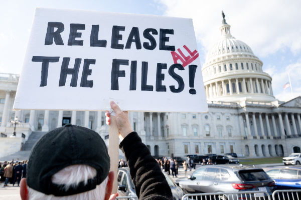 A protester holds a sign related to the release of the Jeffrey Epstein case files outside the Capitol in Washington, DC on Nov.12, 2025. President Trump signed the Congressional legislation that directs the Department of Justice to release the files late Wednesday evening.