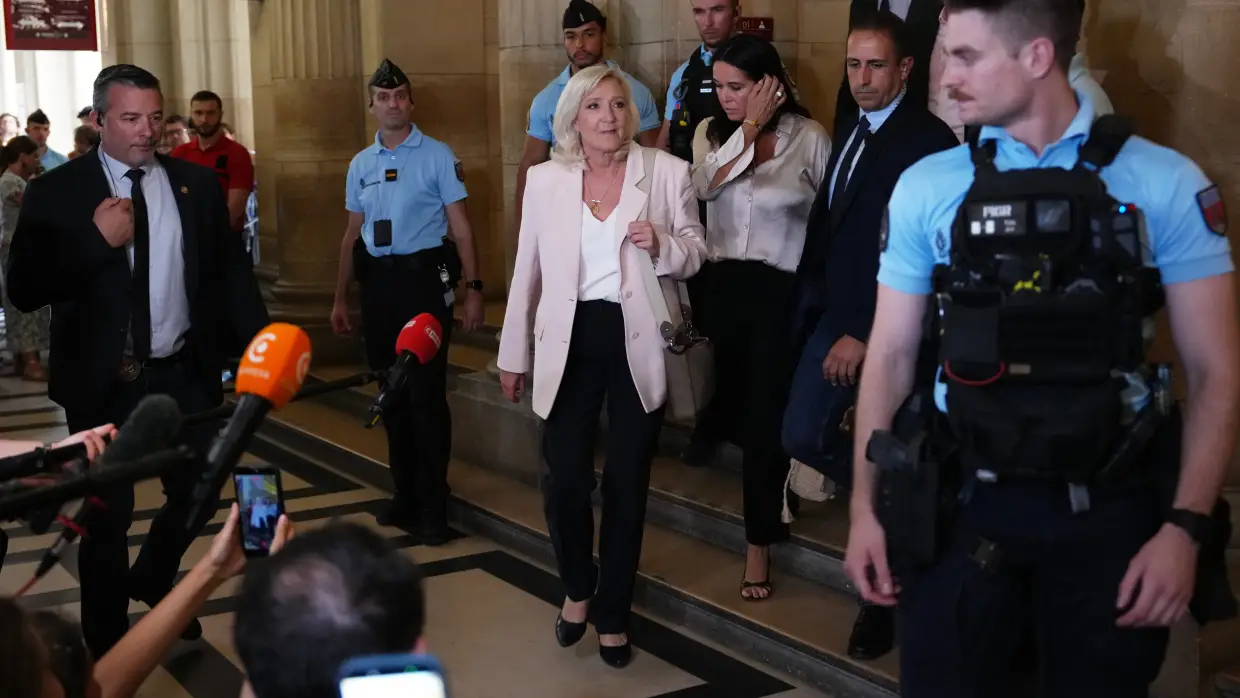 Le Pen says she'll run for French presidency next year despite court-ordered monitor