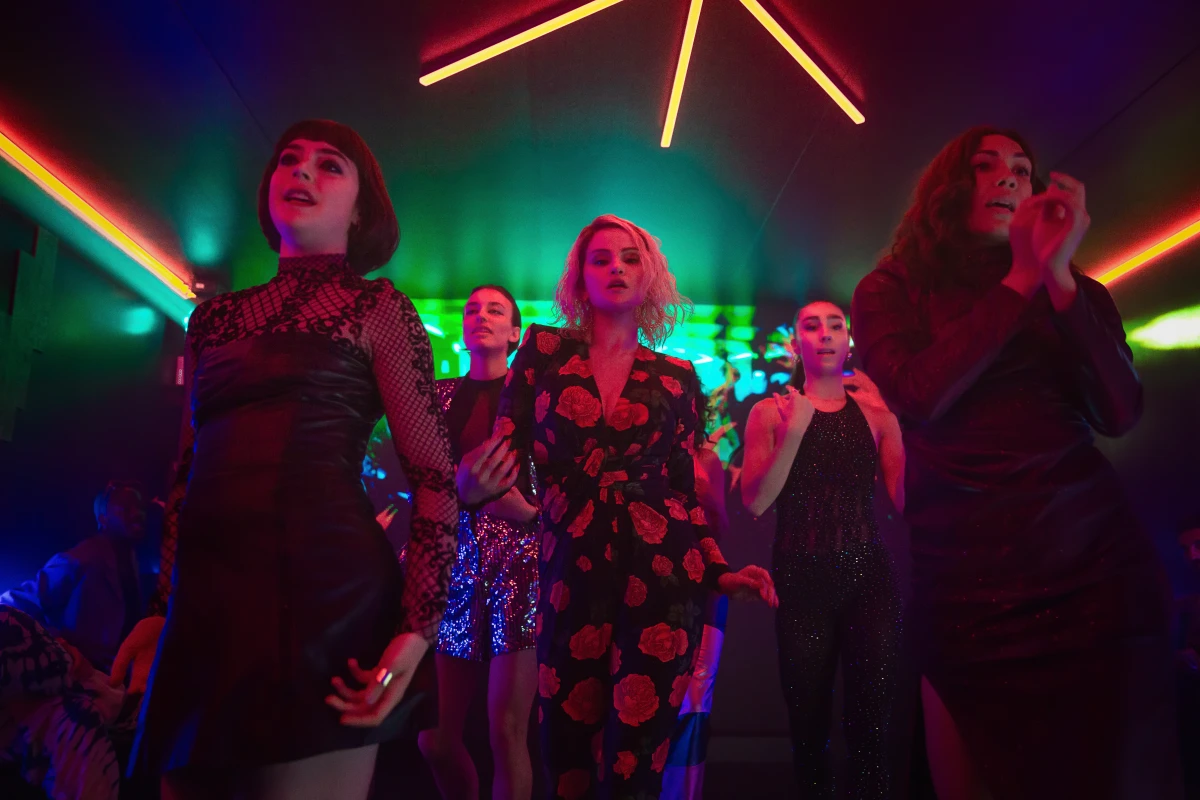 Selena Gomez, center, lets loose as Jessi, the wife of a drug lord known as 'Manitas' in Jacques Audiard's Emilia Pérez.