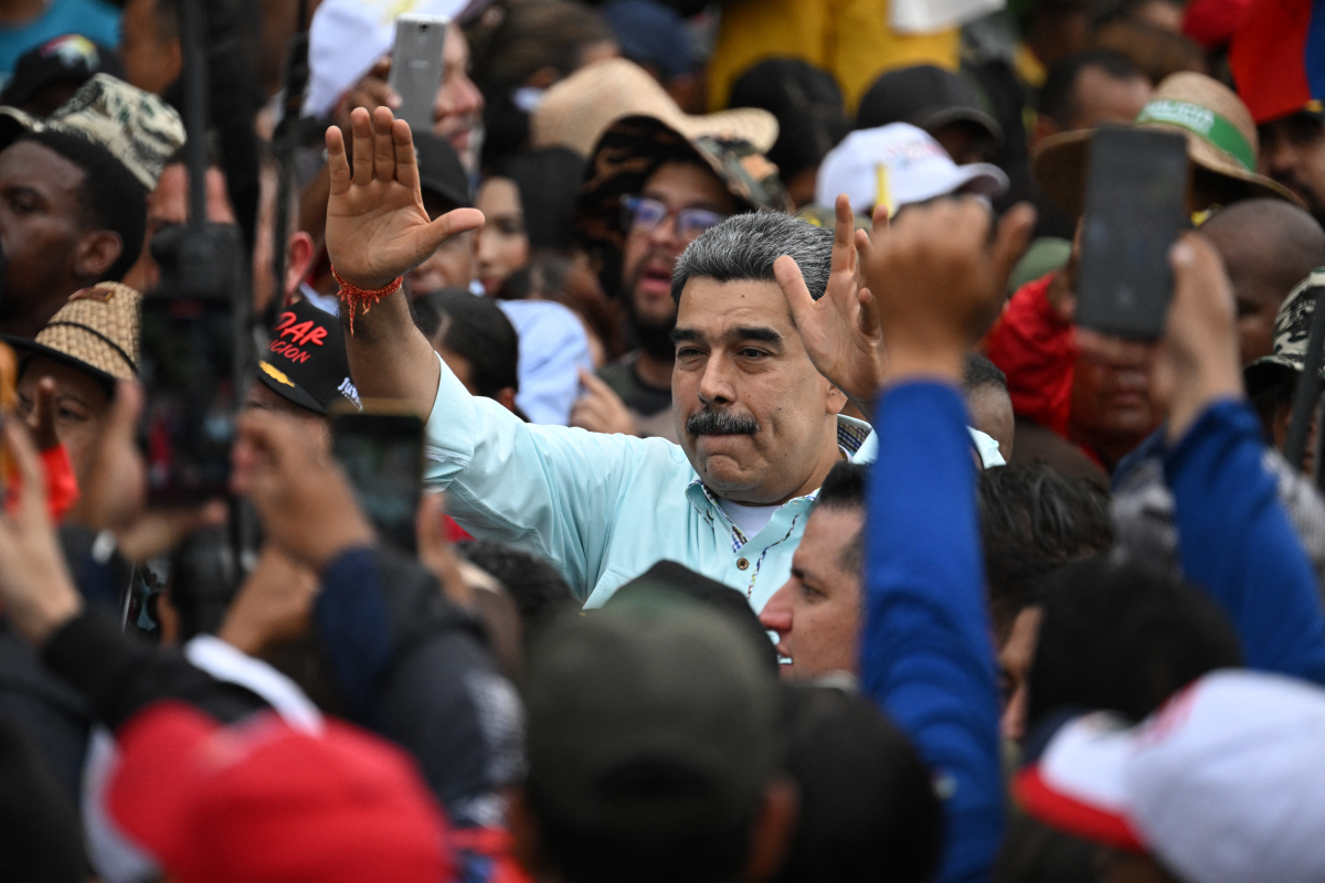 Maduro greets supporters upon his arrival at a rally in Caracas on December 10.