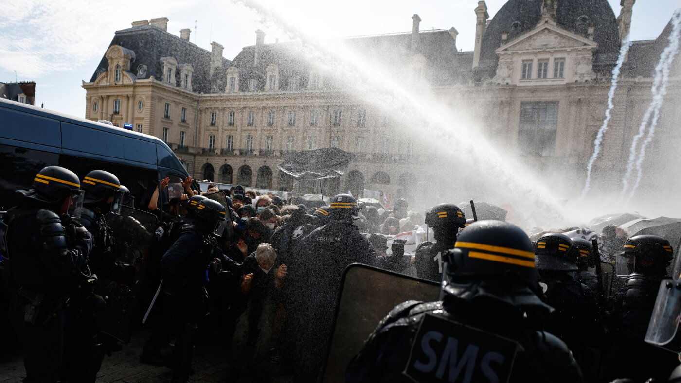 France national day of protests face down riot police, tear gas, water cannons : NPR